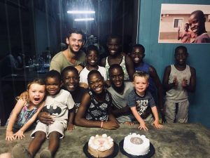Jordan Olney with children in Mozambique