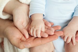 Parents and baby hands